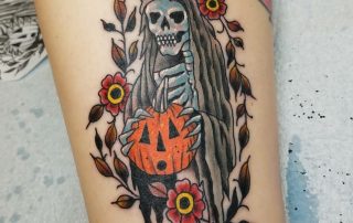Tattoo of a grim reaper