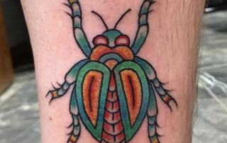 Tattoo of a bug